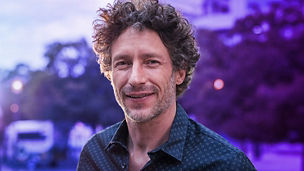 Portrait of happy mature man looking at camera outdoor. Senior businessman with beard feeling confident at sunset. Closeup face of business man smiling with city in background.; Shutterstock ID 1303625389; purchase_order: Markets; job: Britt; client: Alumni