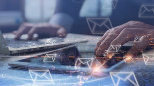 Digital marketing, Email campaign, newsletter, direct sales business strategy concept. Double exposure of business man sending email via digital tablet, laptop computer and smart city with e-mail icon