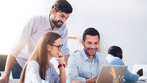 Pleasant smiling colleagues discussing project