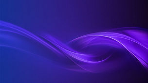 A person using a laptop whilst holding a pen