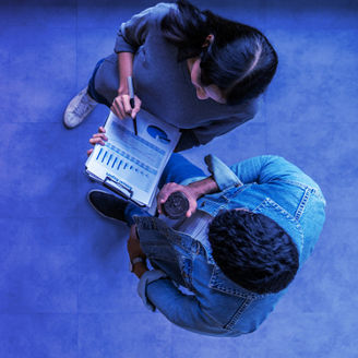 Banner of top view of young asian business team standing, talking and reporting with annual report document in modern workplace. Above view of casual creative team discussion with report performance.