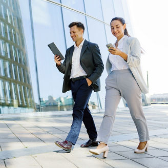 businessman and businesswoman walking