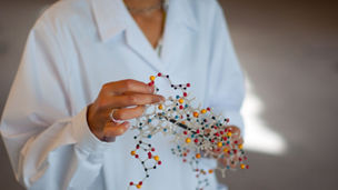 science woman holding helix