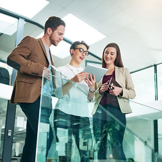 Group, people and conversation with tablet in modern office for lens flare, collaboration and reading report. Tech, agency and team by railing with idea discussion and strategy planning for meeting.