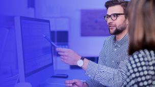 Man pointing at computer screen