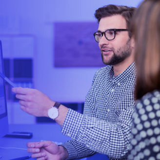 Man pointing at computer screen