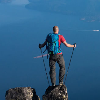 Hiker trekking over ocean views