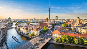Aerial view of Berlin skyline with famous TV tower and Spree river in beautiful evening light at sunset, Germany.