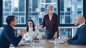 Group of business persons talking in the office