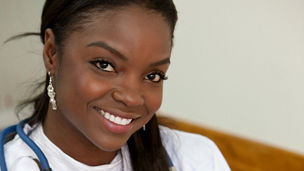 female doctor in a hospital smiling portrait
