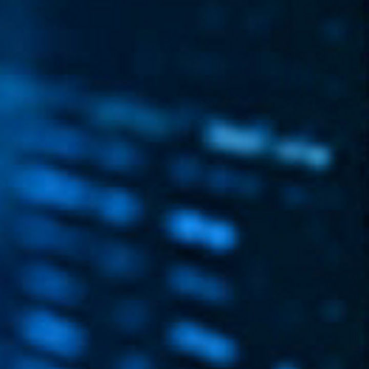 Blue circuit board against black background