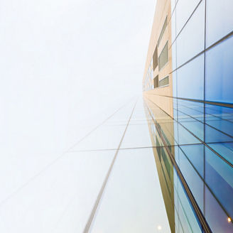 blue glass building view from bottom