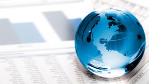 blue globe on statistic papers