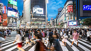 People crossing at Shibuya at dusk.