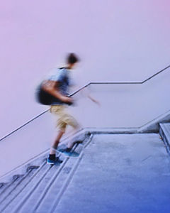 Blurred student walking up stairs