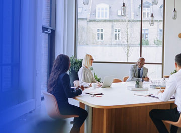 Smiling group of diverse businesspeople having a boardroom meeting together KPMG US CISO article