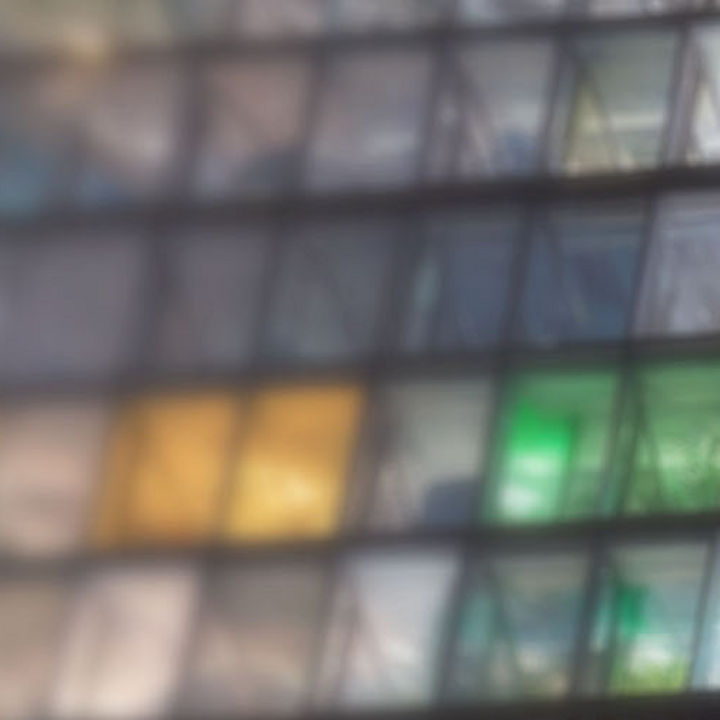 The glass façade of an office building