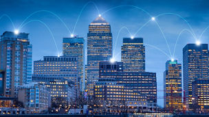 Buildings in a city with a connected web graphic