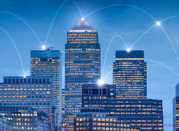 Buildings in a city with a connected web graphic