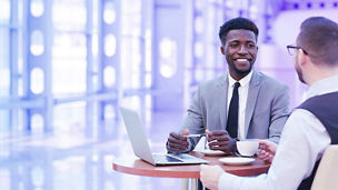 Business men discussing with coffee