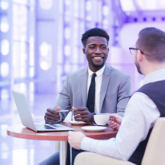Business men discussing with coffee