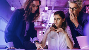 Colleagues discussing something in tablet