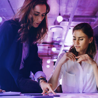 Colleagues discussing something in tablet
