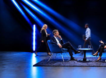 Business people sitting on chairs