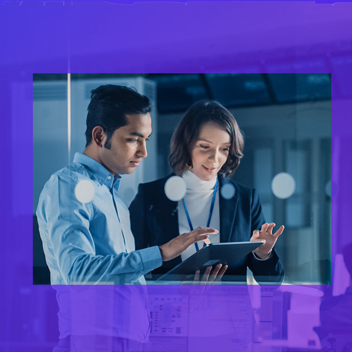 Business man and woman using tablet in office server room banner