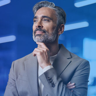 business-professional-in-a-gray-suit-with-a-blue-gradient-background