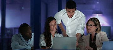 Business people meeting around laptop man in white shirt pointing dark