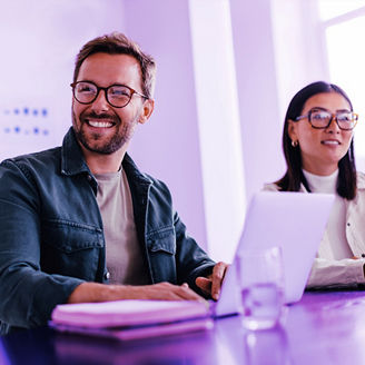 Businessman and woman laughing