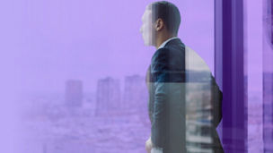 Businessman looking out of window