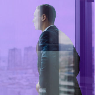 Businessman looking out of window
