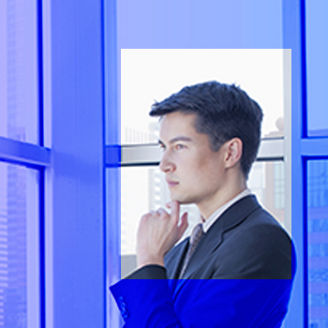 Businessman looking out of office window