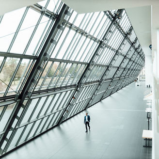 Businessman walking in office corridor