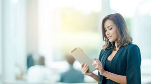 Businesswoman using tablet in office