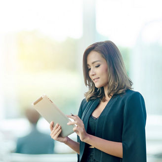 Businesswoman using tablet in office