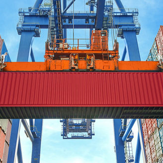 Cargo containers lifting through metallic crane
