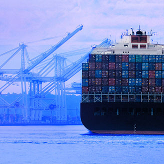 Cargo ship and cranes at harbor banner 