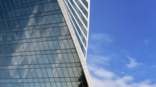 Part of the modern high-rise building on the blue sky background
