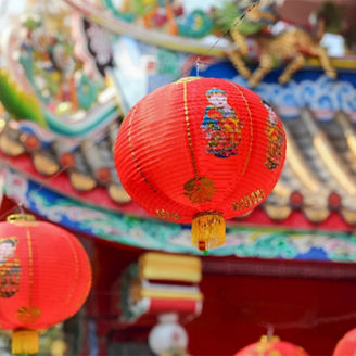 Chinese roof with paper lanterns hanging