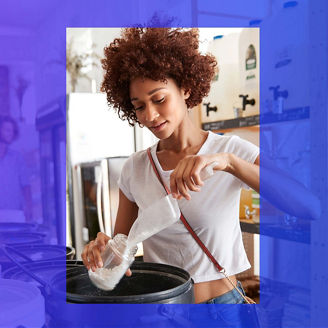 Woman pouring washing powder in container