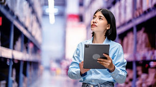 woman on her tablet checking supply