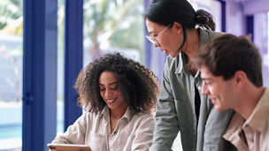colleagues laughing and working togehter