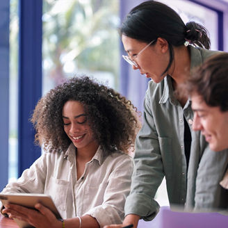 colleagues laughing and working togehter