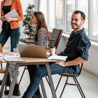 colleagues sitting around a table in an office