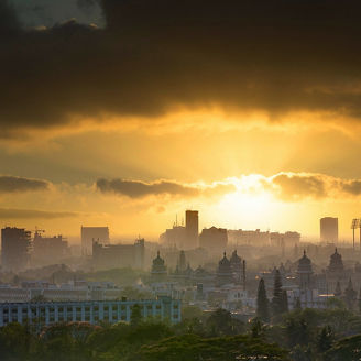 Modern office building or business center. High-rise windor buildings made of glass reflect the clouds and the sunlight. empty street outside  wall modernity civilization. growing up business