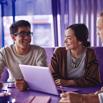 Happy friends talking in cafe