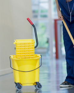 Cleaning floor with yellow bucket, modern slavery, cleaner, hospital, mop